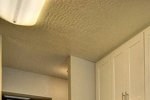 Kitchen with Cabinetry, Refrigerator and Hardwood Inspired Floor